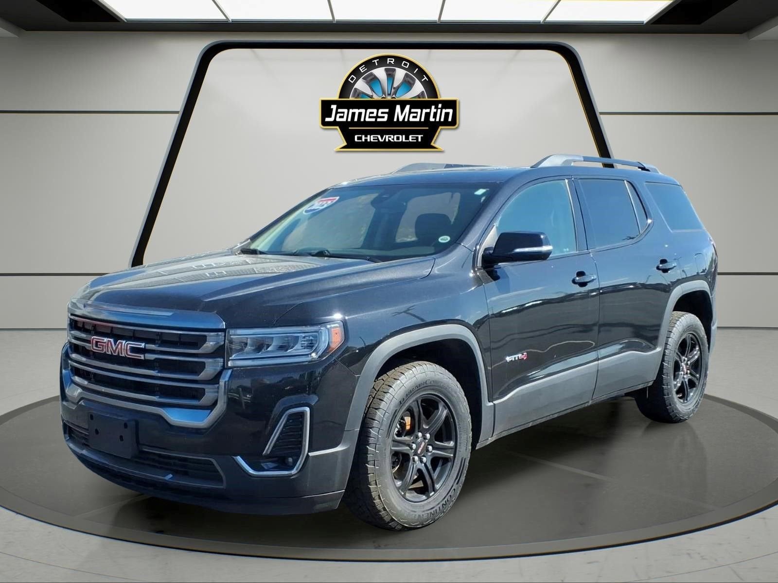 2023 GMC Acadia AT4 in Ebony Twilight Metallic — front three-quarter view