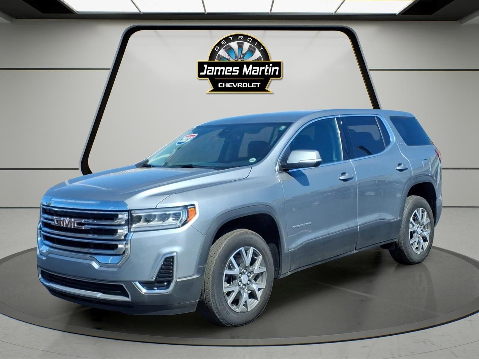 2023 GMC Acadia SLE in Sterling Metallic — front three-quarter view